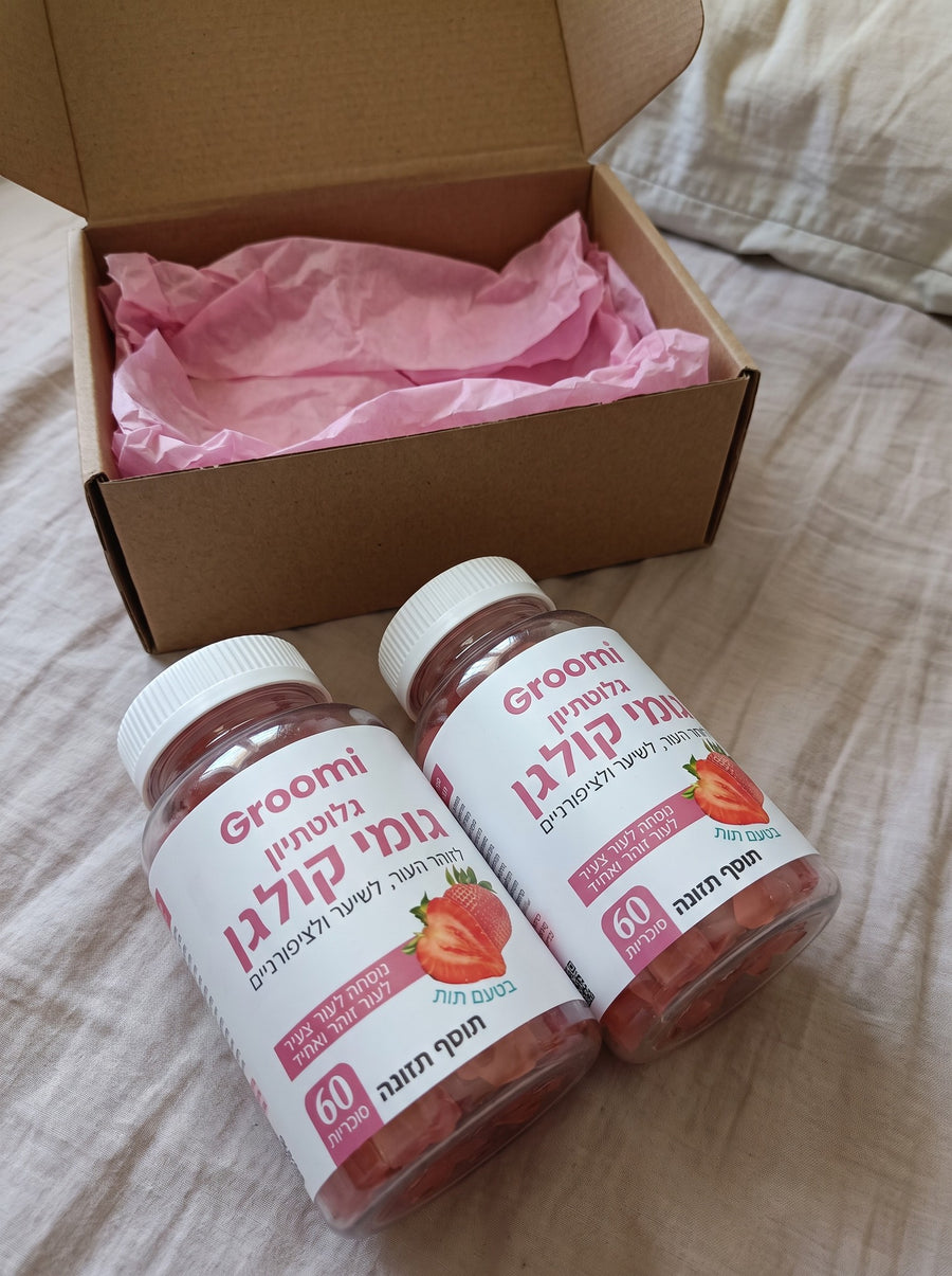 שני בקבוקי גומי קולגן של Groomi ליד קרטון משלוח